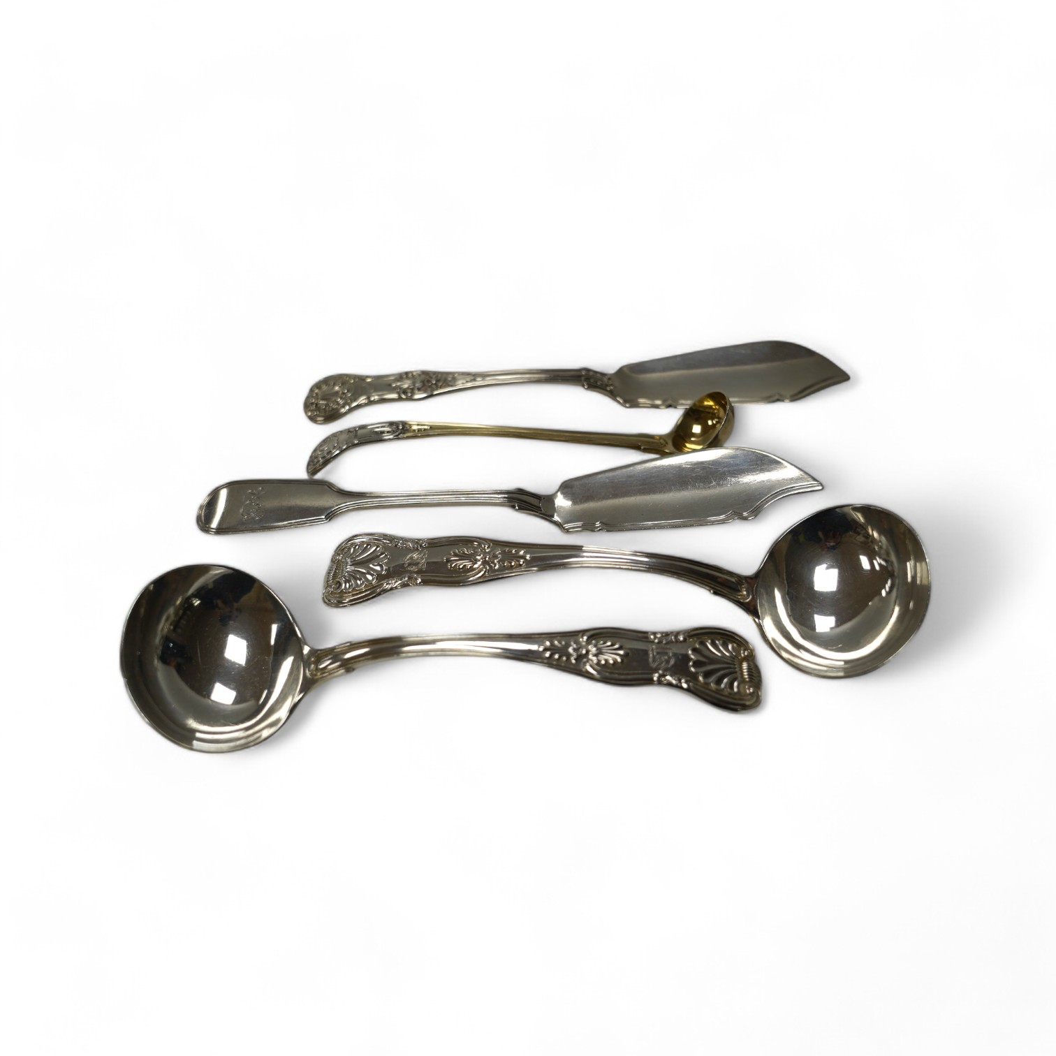 A pair of George IV silver King's pattern sauce ladles, by William Eaton, London, 1824, 17.5cm, two Victorian silver butter knives and a Victorian silver condiment spoon, 13.7cm, 10.5oz. Condition - fair to good